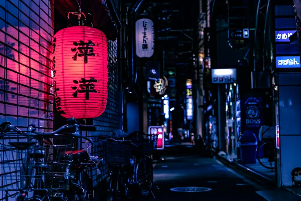 A lantern-lit Japanese alley at night